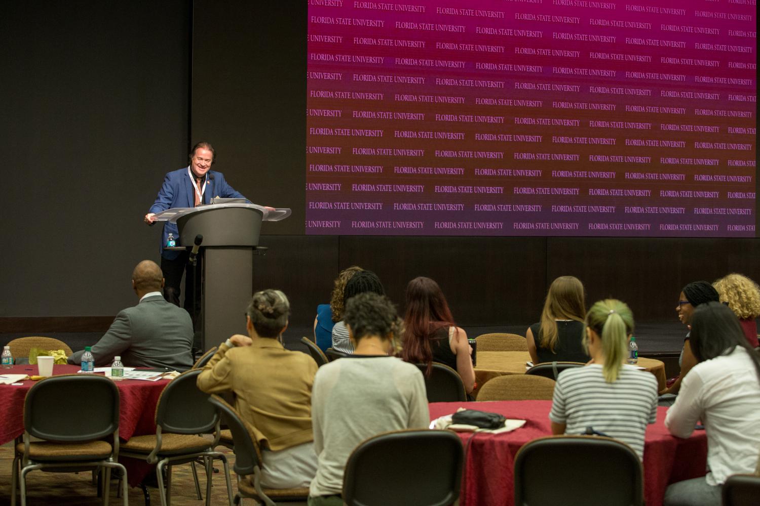 Dean Riley speaking at Fall Symposium